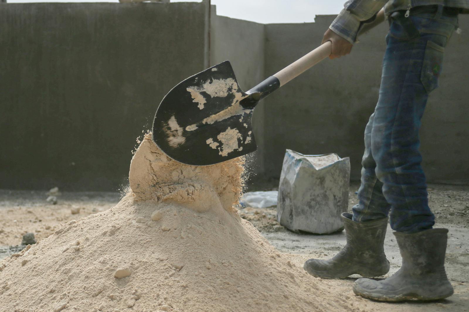 Photo by Maria Turkmani Man Working with Showel on Construction Site